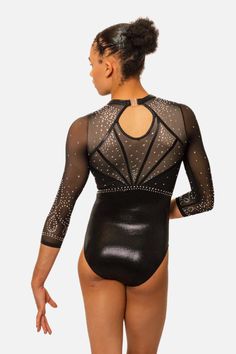 a woman wearing a black bodysuit with sheer mesh and sequins on the back