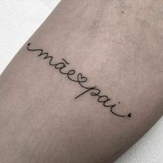 a tattoo that says love on the side of a person's leg and is written in cursive writing