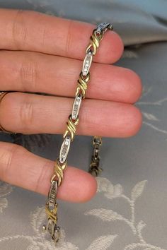 This is a fine vintage 10k yellow and white gold (marked and electronically tested) bracelet set with pretty baguette diamonds (tested as diamonds). Each of the ten (10) white gold oval links are set with seven (7) tapered straight baguette diamonds with an average colour grade of J-K and a clarity of approximately I1. My estimate is the bracelet contains a total of approximately 1.5 or slightly more carats of diamonds. This classic bracelet weighs 7.37 grams and measures 7.0 inches in length wi Gold And Diamond Bracelet, Sweet Ring, Classic Bracelets, Special Ring, Baguette Diamonds, Bracelets Gold Diamond, Wedding Jewelry Bracelets, Box Clasp, Diamond Settings