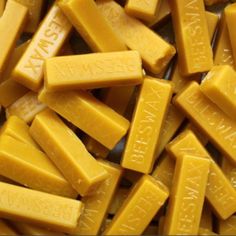 a pile of yellow cubes with words on them