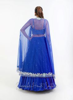 Royal Blue Color Skirt with Crop Top – Panache Haute Couture Blue Wedding Gown With Cape Sleeves, Blue Georgette Evening Dupatta, Blue Georgette Dupatta For Evening, Traditional Blue Choli For Evening, Designer Hand Embellished Blue Dupatta, Designer Blue Georgette Gown, Blue Anarkali Set Hand Embellished, Fitted Royal Blue Georgette Dupatta, Elegant Blue Georgette Lehenga