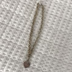 Authentic Tiffany & Co Necklace In Great Condition! Includes Monogram A.G.F On Back Of Heart Tag As Pictured. A Jeweler Could Easily Buff It Off. Have Not Worn In Years, So Hoping To Find It A New Home. Details Below, Let Me Know If You Have Any Questions! Sterling Silver With A Round Brilliant Diamond 15" Long Motif Size, Medium Lobster Closure Carat Weight .02 Product Number:70923475 Tiffany Heart Toggle Necklace, Engraved Necklace Tiffany & Co., Tiffany Heart Tag With Key Pendant, Heart Pendant Gold Tiffany & Co., Letter Pendant Necklace Tiffany & Co., Tiffany And Co Necklace, Heart Tag, Tag Necklace, Tiffany & Co.