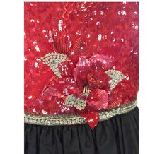 This exquisite dress has an intricately sequined and embroidered bodice and a full black silk skirt. The bodice has a crewneck and is sleeveless and has three dimensional red sequined flowers and clear beads. If you look closely you can see there's even silk embroidery accenting the areas. The neckline and waistline are trimmed with clear bugle beads. The closure in the back is a zipper with the hook and eye and the label is on the shoulder. The skirt is in excellent condition. The size is appro Black Silk Skirt, West Chester Pa, Embroidered Bodice, White Gold Solitaire, West Chester, Clear Beads, Ball Gowns Evening, Bugle Beads, Silk Embroidery