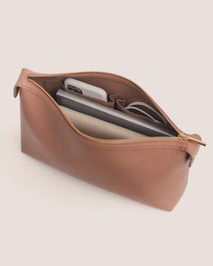 Crafted from our signature double-faced Italian leather, our Pouch Insert provides extra organization and a zippered compartment for your tote, with two interior slip pockets for your valuables. Tote Insert, Elegant Pouch, Business Accessories, Small Leather Accessories, Leather Pouches, Small Zipper Pouch, Oversized Clutch, Feed Ig, Leather Industry