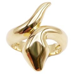 Rossella Ugolini Bold Snake ring, meticulously handcrafted in 18k Yellow Gold. This exquisite piece boasts a captivating design where the sinuous snake elegantly wraps around the finger, with its head and tail seamlessly connected in a single line, imparting dynamic movement to the hand. Handmade in Italy using the carved wax technique, this timeless ring exudes ageless allure, perfect for everyday wear and any occasion. Luxurious statement accessory that effortlessly merges craftsmanship and so Luxury Yellow Gold Unique Snake Ring, Luxury Fine Jewelry Yellow Gold Snake Ring, Hollow Form, Dynamic Movement, Timeless Ring, Heads And Tails, Snake Design, Single Line, Snake Ring