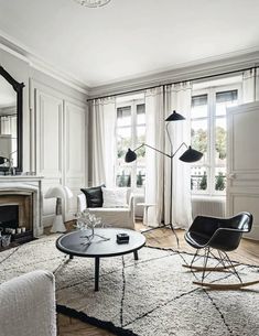 a living room filled with furniture and a fire place