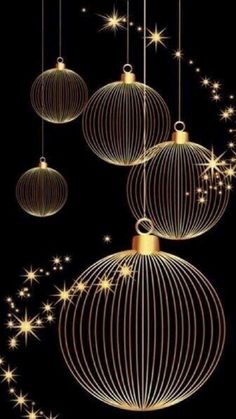 three christmas ornaments hanging from strings with stars in the sky behind them on a black background