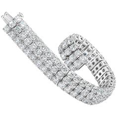 This bracelet features 108 stones of brilliant cushion cut diamonds weighing an astounding 44.30 carats total. All stones are very white and perfectly matched. Set in a three row setting. A very elegant and timeless piece. Style available in different price ranges. Prices are based on your selection of the 4C’s (Carat, Color, Clarity, Cut). Please contact us for more information. Gold Diamond Watches, Dream Bracelet, Black Gold Jewelry, Expensive Jewelry Luxury, Modern Bracelets, Cushion Cut Diamond, Antique Bracelets, Jewelry Showcases, Cushion Diamond