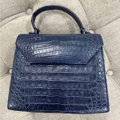 Pre Owned Nancy Gonzalez Medium Lily Genuine Crocodile Crossbody Bag Only Worn Few Times. Has A Long Strap. Has A Minor Strap Damage (See Last Picture) Blue Leather Shoulder Bag With Crocodile Pattern, Blue Textured Leather Top Handle Bag, Blue Textured Leather Evening Bag, Blue Luxury Textured Leather Satchel, Luxury Blue Textured Leather Satchel, Blue Rectangular Shoulder Bag With Crocodile Pattern, Nancy Gonzalez, Crossbody Bag, Bag Lady