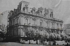 an old black and white photo of a building