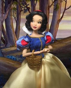 a doll is holding a basket in front of some trees and the background looks like it's from snow white