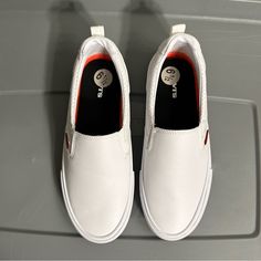 Women’s Sneakers White Casual Slip-ons For Sports, White Low-top Slip-ons For Sports, Everyday White Synthetic Slip-on Sneakers, White Round Toe Slip-ons For Everyday, Everyday White Slip-ons With Round Toe, Levi's Sporty Round Toe Sneakers, Sporty White Slip-on Sneakers For Everyday, White Casual Slip-on Sneakers For Everyday, Casual White Slip-on Sneakers For Everyday