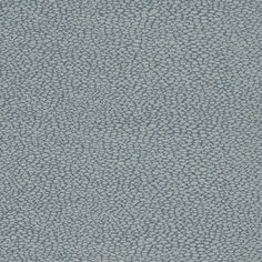 an upholstered blue fabric with small white dots