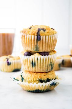 three blueberry muffins stacked on top of each other with text overlay