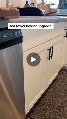 a kitchen with white cabinets and stainless steel dishwasher on the floor, in front of a window that reads tea towel holder upgrade