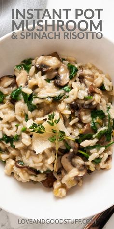 mushroom and spinach risotto in a white bowl with silverware on the side