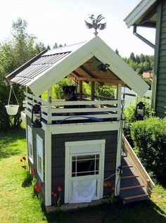 the dog house is built into the grass