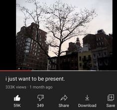 an image of a tree in the middle of a city with no leaves on it