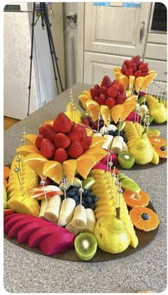 a table topped with lots of fruits and veggies