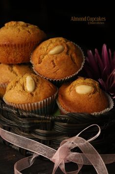 some muffins are sitting in a basket on a table