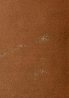 an old brown paper with white writing on it