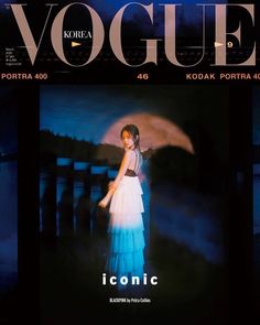 the front cover of a magazine with a woman holding an umbrella in it's hand