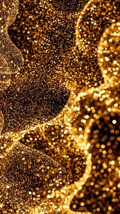 an abstract gold background with lots of small dots