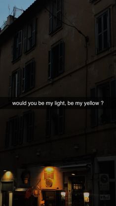 a building with the words would you be my light, be my yellow? on it