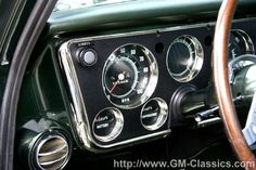 an old car dashboard with gauges and dash lights