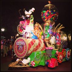 an elaborately decorated carnival float with lots of candy