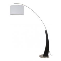 a floor lamp with a white shade on the base and a black metal pole underneath it