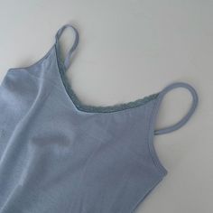 Casual Tops With Lace Trim, Casual Non-stretch Tops With Lace Trim, Fitted Light Blue Spaghetti Strap Top, Trendy Spaghetti Strap Tops For Loungewear, Trendy Spaghetti Strap Loungewear Tops, Trendy Loungewear Spaghetti Strap Tops, Trendy Spaghetti Straps Tops For Loungewear, Spring Solid Color Cami Top, Trendy Stretch Camisole With Lace Trim