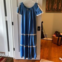 1970’s With Original Price Tags Vintage Hilda Hawaii Maxi Dress. Never Worn. Vintage Size 12, Would Fit A Generous Medium. Pit To Pit 19”. Has Pockets And Is Flawless. Split Lace Trim Short Sleeves. Blue And Pink Calico With White Lace Trim. A True Beautiful Piece! Vintage Blue Maxi Dress For Vacation, Vintage Short Sleeve Midi Dress For Vacation, Vintage Blue Maxi Dress With Short Sleeves, Blue Lace Trim Maxi Dress For Daywear, Blue Maxi Dress With Lace Trim For Daywear, Blue Lace Trim Vintage Summer Dress, Vintage Maxi Dress For Vacation, Blue Vintage Dress With Lace Trim For Summer, Vintage Blue Midi Length Maxi Dress