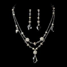 "Stylish and elegant, this silver or gold plated necklace and earring set is the perfect accessory for your wedding, honeymoon or special occasion. The set features freshwater pearls and clear Swarovski crystals, the perfect finishing touch to your vintage chic or classic wedding dress. READY TO SHIP DETAILS: - Necklace: 15\" long with a 2.5\" adjustable extender, Earrings: 1.5\" long. - Earrings - 2\" (Length) - Offered in Gold or Silver COORDINATING SASHES, CUFF BRACELETS & FASCINATORS, VI Silver Costume Jewelry Sets For Weddings, Silver Crystal Jewelry With Pearl Drop, Silver Jewelry Sets With Pearl Drop For Formal Occasions, Silver Dangle Jewelry Sets For Anniversary, Elegant Silver Dangle Jewelry Sets, Gold Sterling Silver Jewelry Sets For Wedding, Silver Crystal Jewelry Set With Pearl Drop, Classic Wedding Necklace With Matching Earrings, Classic Silver Jewelry Sets With Pearl Drop