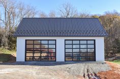 two garages with large windows on each side