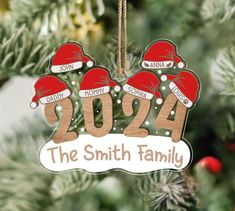 personalized christmas ornament hanging from a tree