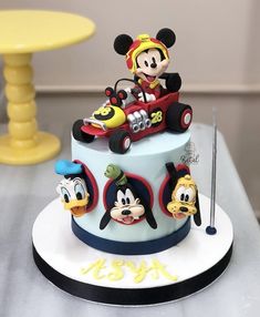 a mickey mouse birthday cake on a table