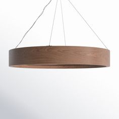 a wooden light fixture hanging from a ceiling