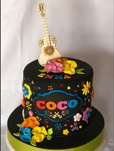 a decorated cake with a guitar on top