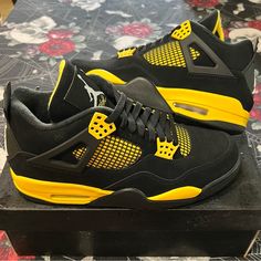 Ds 2023 Nike Air Jordan 4 Iv Thunder Black/Tour Yellow Mens Sz 10 Dh6927-017 Nib. Og All. - For The First Time In Over A Decade, The Air Jordan 4 Retro Thunder Is Returning And Is Being Featured As Part Of The Jordan Brand Spring/Summer 2023 Campaign. Jordan Brand Brought Back This Fan Favorite Colorway That Is Constructed Using Premium Black Nubuck Uppers With Splashes Of Tour Yellow Throughout The Midsole, Lace Eyelets, And Tongue. Michael Jordan's Iconic Jumpman Logo Is Placed On The Heel Tab Court Purple Jordan 1, Jordan 4 Retro Thunder, Jordan 4 Thunder, Blue High Tops, Jordan Basketball Shoes, Champion Sneakers, Nike Air Jordan 4, Retro Basketball Shoes, Jordan Grey