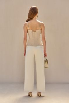 A cotton sateen wide-leg pant with asymmetrical diagonal leg seam and functional pockets. — Mid-rise — Side and back pockets — Front zipper — Cotton sateen fabric Top With Peplum, Linen Sleeveless Top, Icon Clothing, Evening Flats, Peplum Styling, Sandal Platform, Swimming Bag, Peplum Styles, Candle Collection