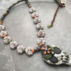 Unique one of a kind hand made autumn necklace featuring a gorgeous hand made ceramic focal by Gaea Canaday. The necklace is made with Czech glass maple leaves and aged seed beads with a lobster closure- 16.5 inches plus adjustable extension. Handmade Multicolor Nature-inspired Beaded Necklaces, Handmade Multicolor Beaded Necklaces, Nature-inspired, Beaded Bohemian Polymer Clay Necklaces, Bohemian Beaded Polymer Clay Necklaces, Bohemian Brown Hand Painted Necklaces, Bohemian Hand Painted Brown Necklace, Bohemian Brown Hand Painted Necklace, Handmade Artisan Polymer Clay Necklaces, Handmade Artisan Polymer Clay Necklace