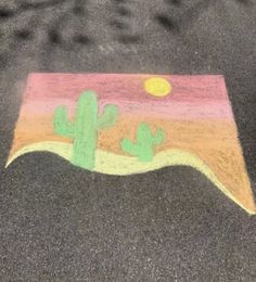 a child's drawing of a cactus on the ground