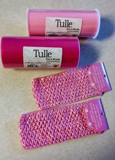 two rolls of pink crocheted fabric next to each other