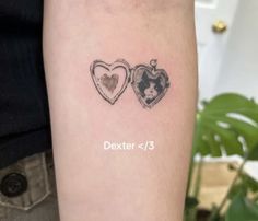 two heart shaped tattoos on the arm with words written below them that read dexter and 3