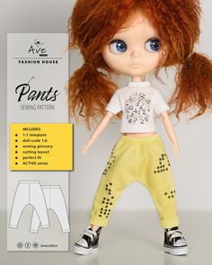 the doll is wearing yellow pants and a white t - shirt with black dots on it