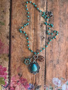 "❤ EveRy DaY WeaR ❤  This DESIGN ~ An array of charms, beads & findings dangle from this 16\" turquoise micro beaded chain. CHARMS selected: Southwestern style drop, czech flower & copper peace sign. jewelry for your heart & soul <-----❤---- NOTE ❤ ---> The listing photos you are seeing are of my original designs. I only change the photos when there is a significant design difference. What this means is, you may receive: a necklace with a different type of bead/charm; a slight difference to the Nickel Free Southwestern Style Necklace With Round Beads, Nickel-free Southwestern Necklace With Round Beads, Rustic Turquoise Jewelry For Festivals, Bohemian Turquoise Pendant Charm Necklaces, Turquoise Beaded Chain Necklace With Dangle, Bohemian Turquoise Dangle Beaded Necklaces, Turquoise Beaded Hippie Necklace, Turquoise Bohemian Jewelry With Vintage Charm, Bohemian Turquoise Beaded Dangle Necklaces