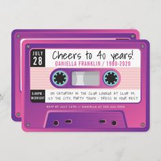 two purple cassettes with the words cheers to 40 years printed on them, sitting next to each other