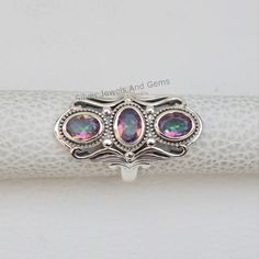 Gemstone-Mystic Topaz Shape-Oval Metal-925 Sterling Silver This One of a kind ring is adorned with beautiful Multicolour Gemstone set in sterling silver. About gemstones-Mystic Topaz is one of a kind stone which showcase multicolour. It sparkle and amazing colors are enough reasons for anyone to be dazzled by them.This beautiful gemstone not only possess physical healing properties but also magical healing properties.Wearer of the stone can be protected from negativity around them. This stone is Iridescent Oval Spiritual Rings, Spiritual Iridescent Oval Rings, Mystic Topaz Ring, Physical Healing, Ring Spacer, Mystic Topaz, Topaz Stone, Silver Rings Handmade, Multi Stone Ring