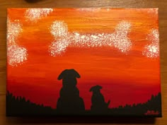 an acrylic painting of two dogs sitting in front of a red and orange sunset